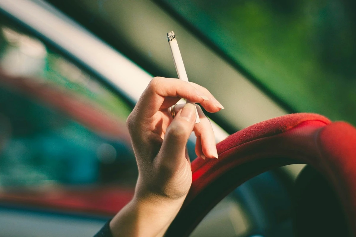 woman holding cigarette smoking