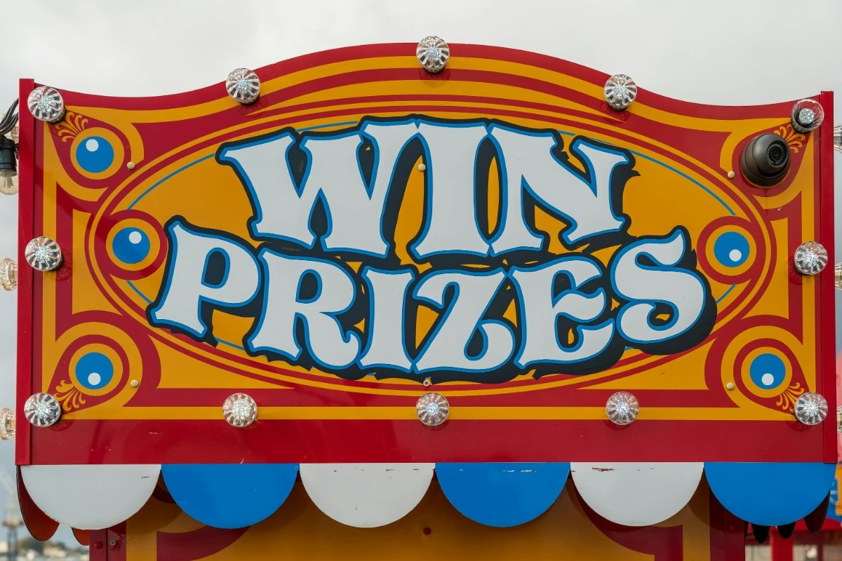 win prizes carnival sign