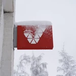 Veikkaus company sign covered in snow