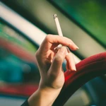woman holding cigarette smoking