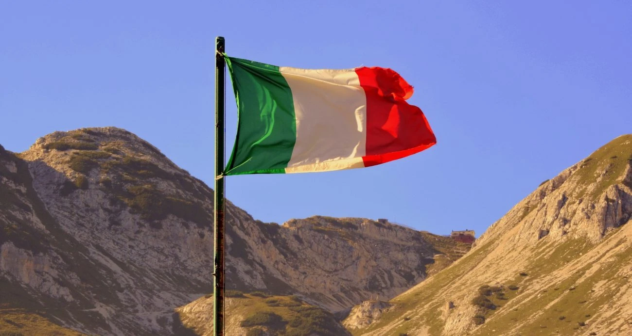 Italy flag with mountains as a backdrop
