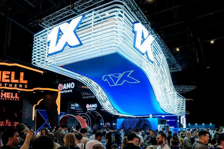 1xbet stand at industry event with people below