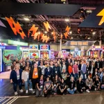 AGS staff members posing together at gaming industry event G2E