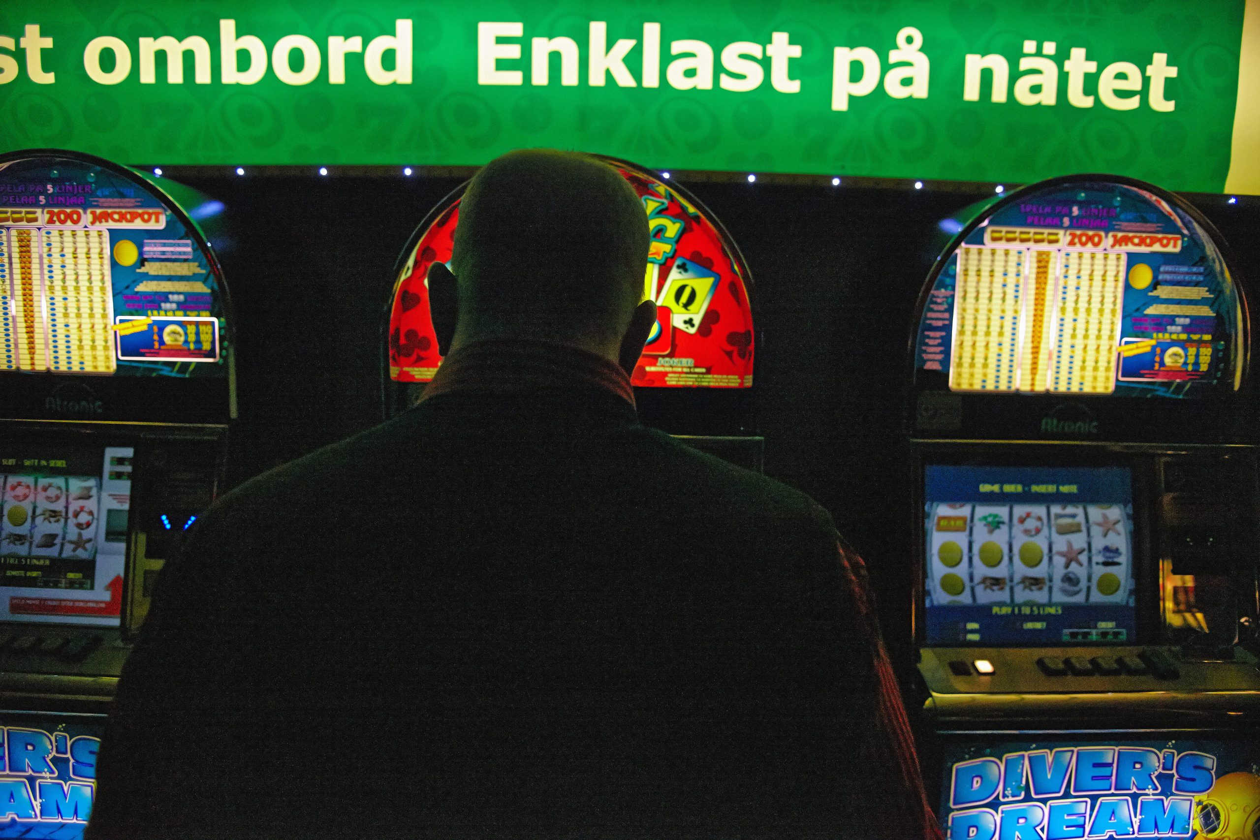 Man gambling at a gaming terminal in Finland