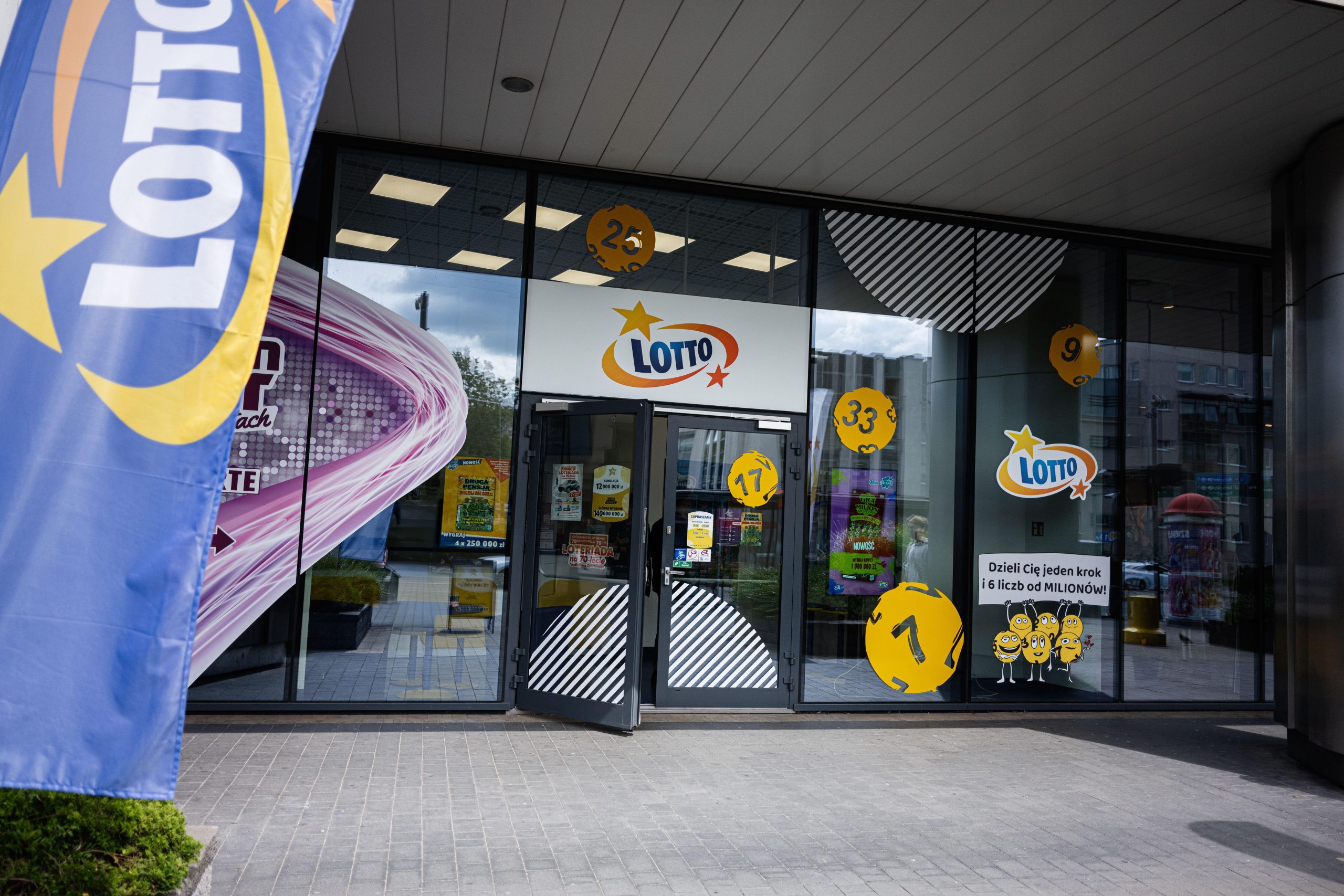 Entrance of a lottery ticket store Lotto in Rzeszow, Poland, showcasing promotional signage
