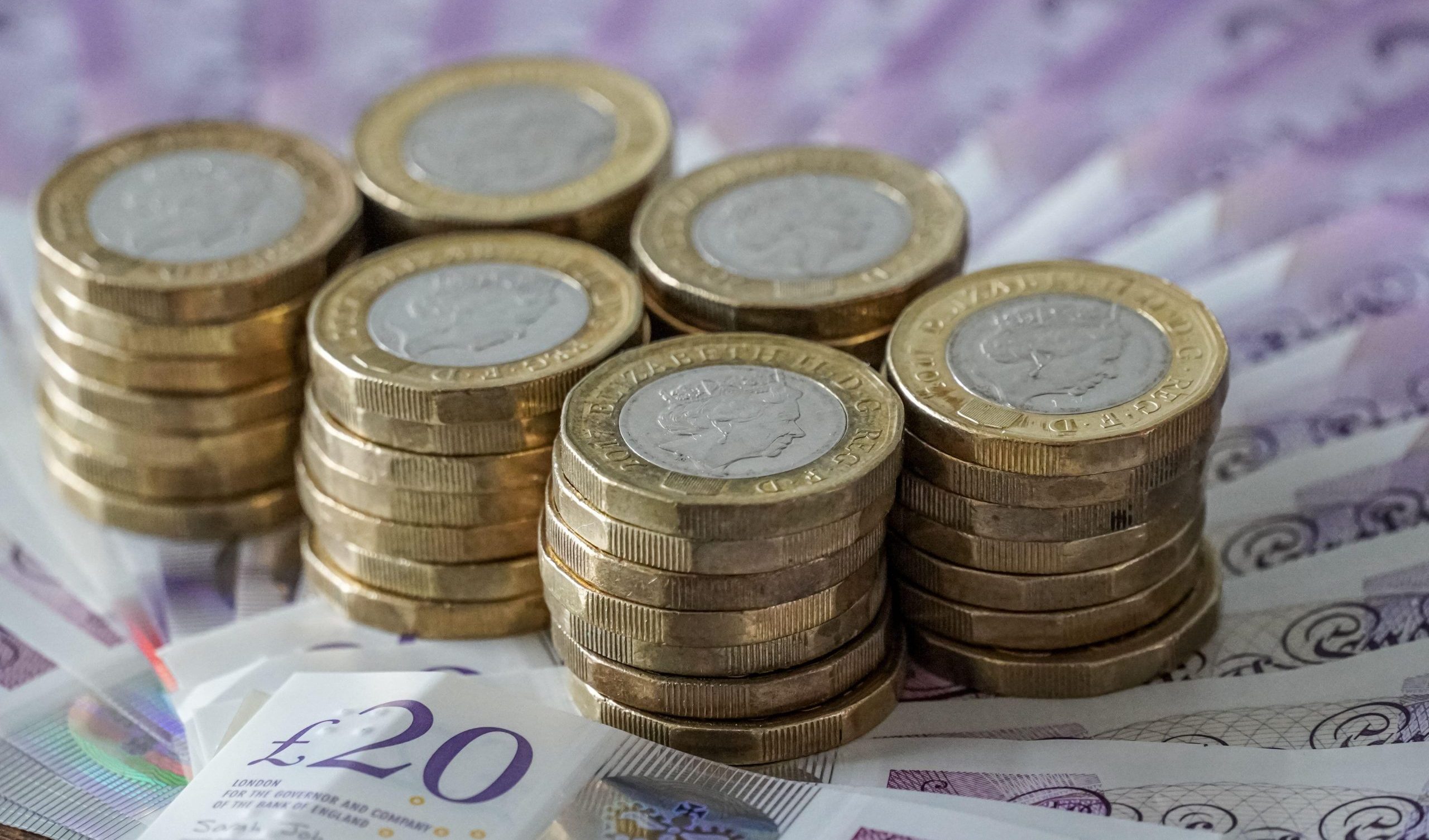 British twenty pound notes and one pound coins